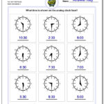Telling Analog Time Along With Time To The Hour Worksheets